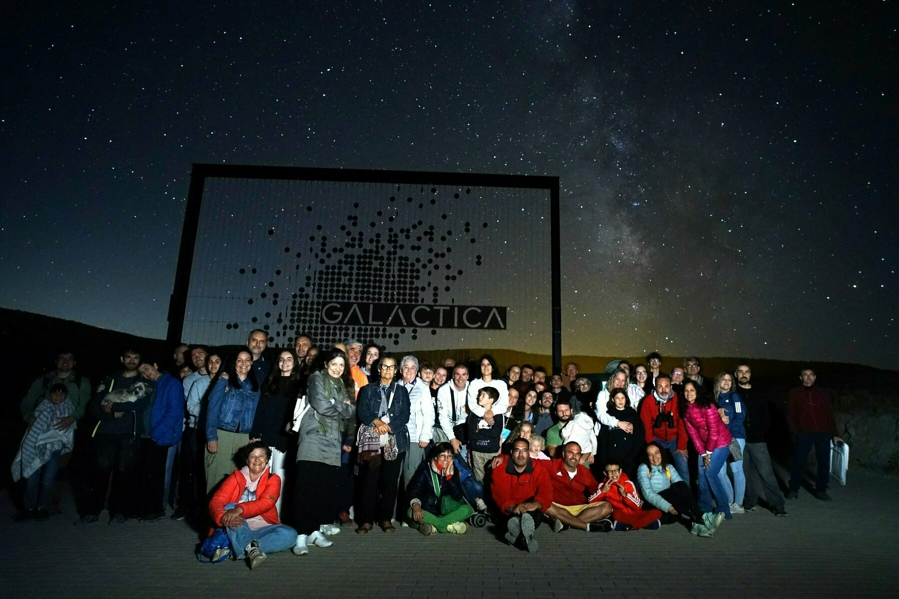 Our group for the GALÁCTICA observation night, with a starry sky and the Milky Way visible in the background.