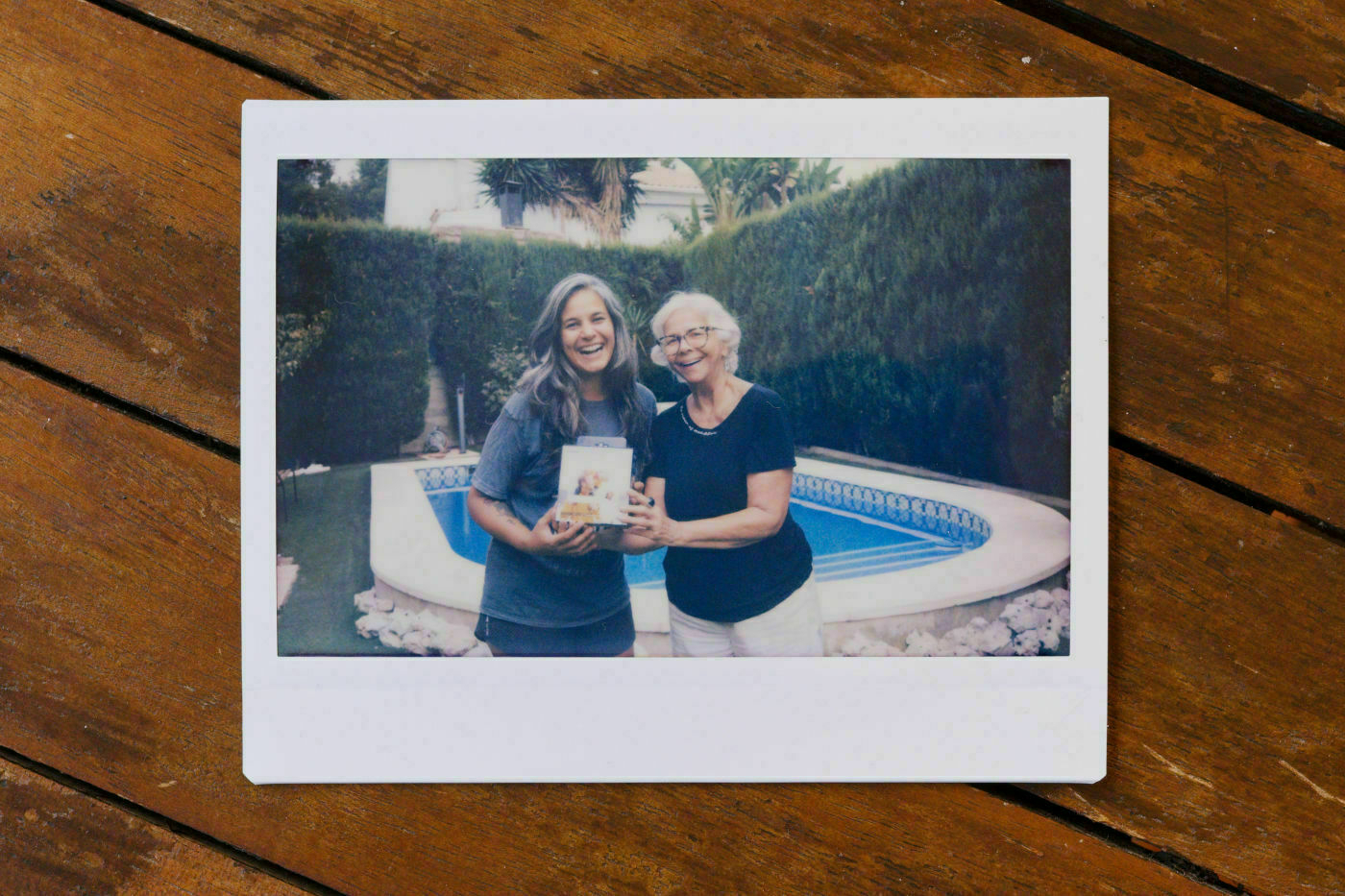 Photo taken on an instax camera, of my mom gifting me an instax printer.
